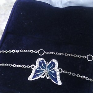 14k 1.29g wg butterfly anklet  