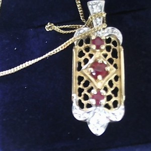 14k 3.34h dia ruby pendant  